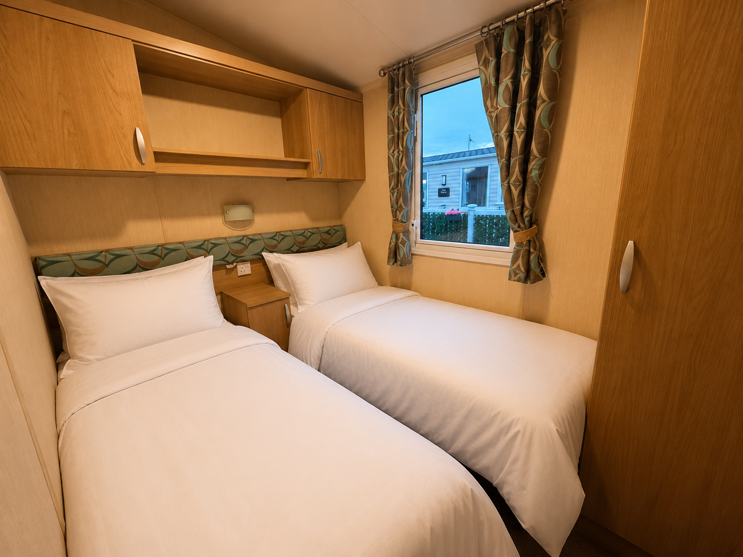 Twin bedroom with two single beds and wardrobe